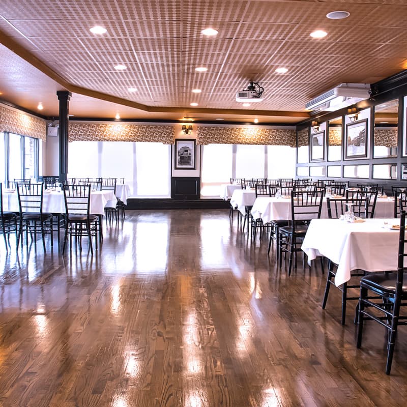 Connolly's Corner private dining room set with white tablecloths